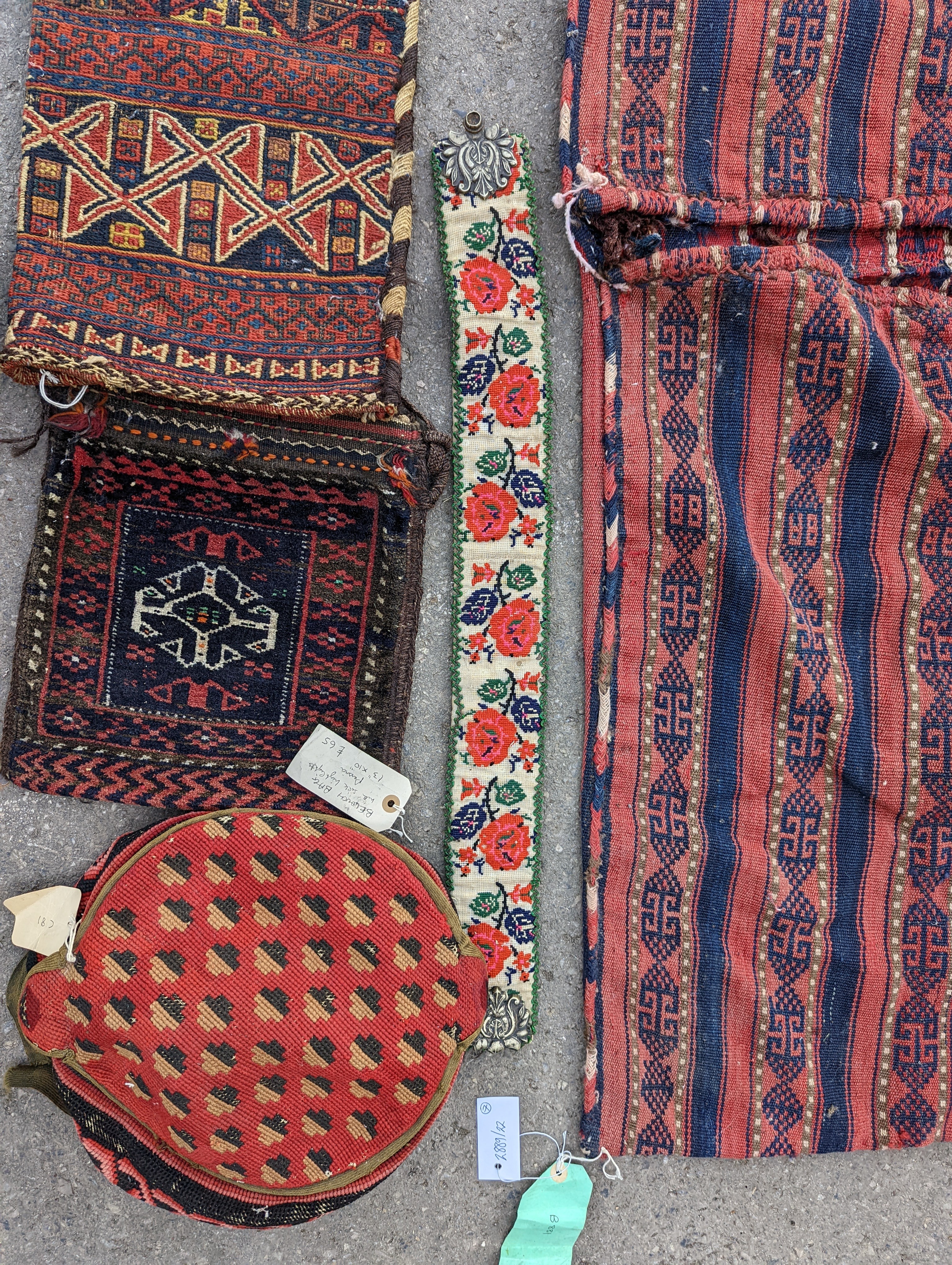 An Afghan Kilim flatweave saddlebag, 144 x 69cm together with six assorted bags, faces, etc.